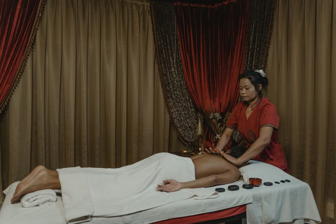 Indian spa guest receiving a gentle full-body massage